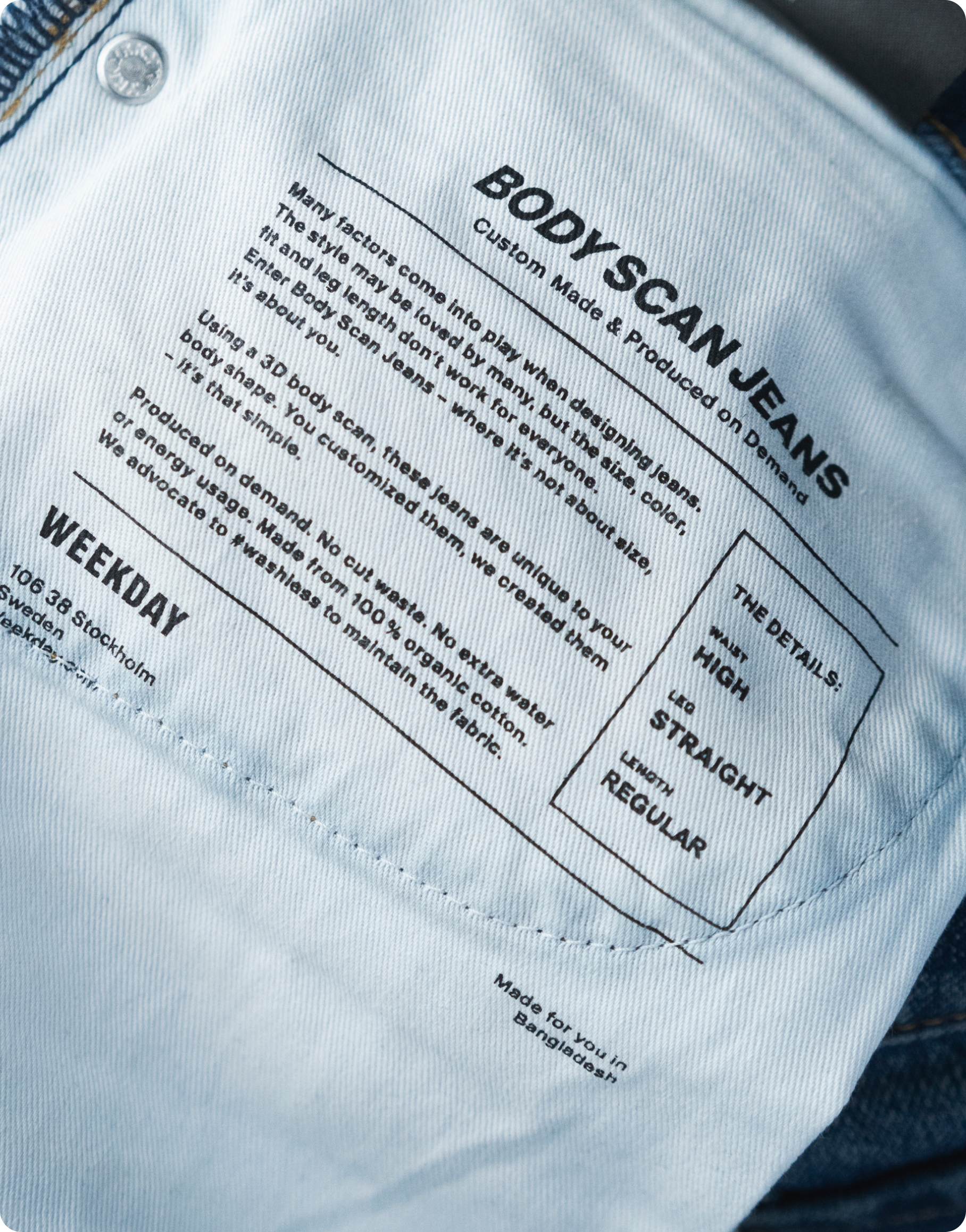 A statement printed on the inside of a pair of Weekday Body Scan Jeans describes the purpose of custom-fit apparel and the advantages of on-demand production.